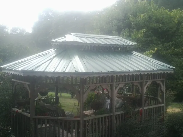Two tier green metal roof on a garden gazebo in Carroll